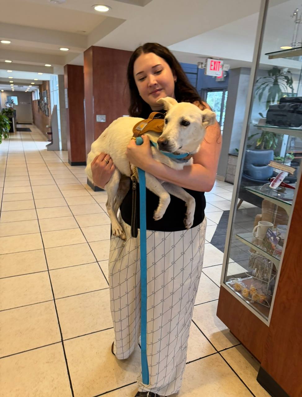 Taylor holding Raina safely indoors